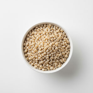 Bowl of whole barley grains