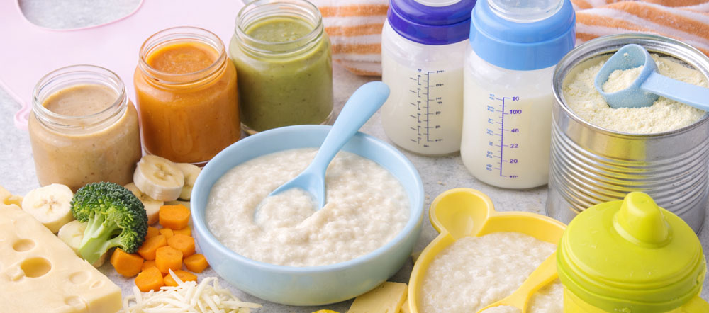 selection of baby food items including milk