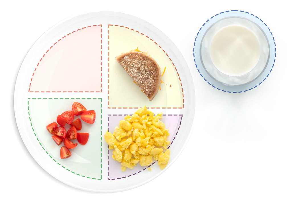 Whole wheat English muffin with cheese, scrambled egg, and tomatoes