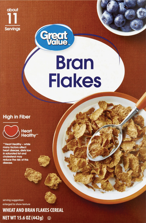 Bowl and spoon with wheat bran flakes cereal.