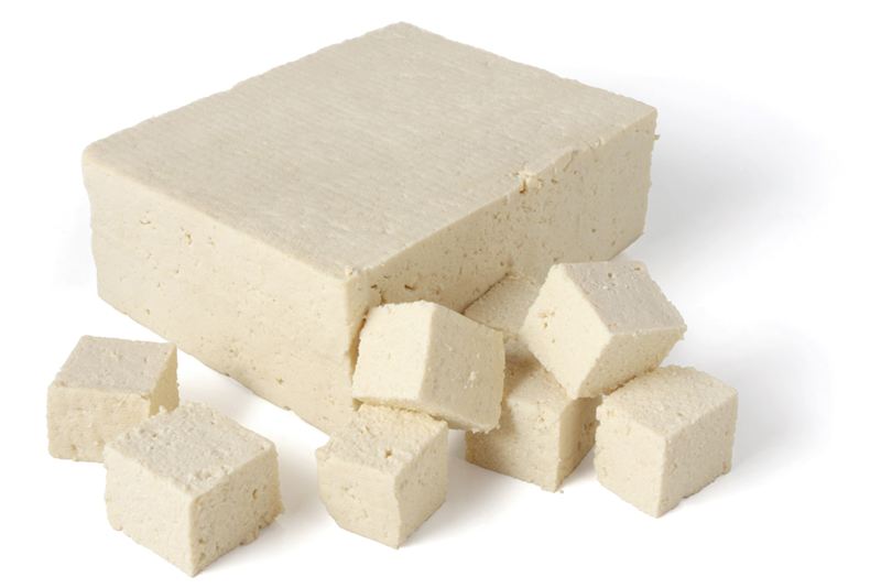 Block and cubes of plain tofu.