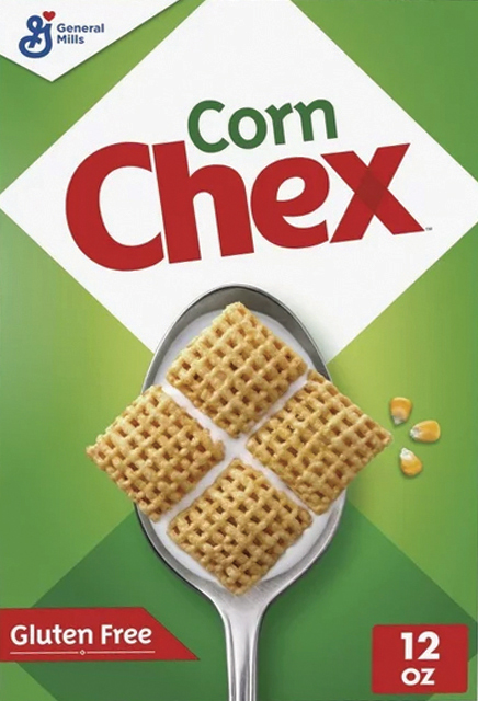 Spoonful of Corn Chex cereal with corn kernels.