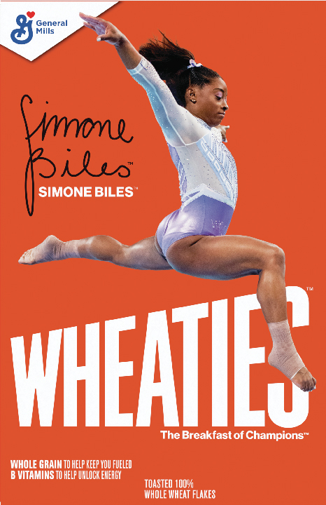 Gymnast performing dynamic leap on cereal box cover.