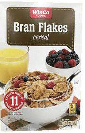 Bran flakes cereal box with berries and juice.